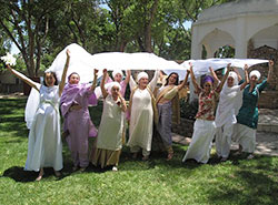 Guru Simrat surrounded by dancing friends